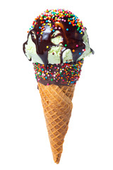 wafer cone decorated colorful sprinkles and chocolate icing with green scoop of ice cream and glaze with strewn of sprinkles isolated on white background