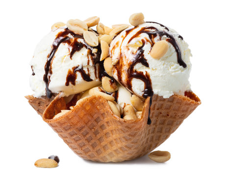 scoops vanilla ice cream decorated chocolate topping and nuts in waffle cone bowl isolated on white background, summer creative concept