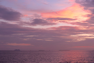 Sea sunset landscape. Pink clouds.