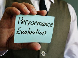 Performance Evaluation written on a piece of paper.