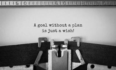 Text A goal without a plan is just a wish typed on retro typewriter