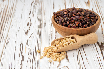 cedar nuts in bowl and scoop
