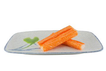 Group crab stick with wasabi sause on plate. isolated on white background with clipping path