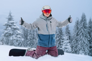 Fototapeta na wymiar Snowboarder with snowboard at powder snow hill. Winter mountains Carpathians