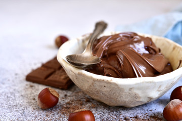Homemade chocolate hazelnut spread in a white bowl .