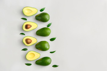 Fresh ripe avocados on white background