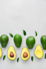 Fresh ripe avocados on white background