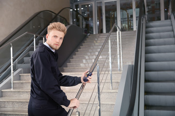 Male security guard in building
