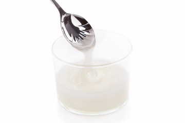 Inverted sugar syrup pouring from a spoon