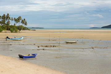 Boats at low tide. Sea cost.