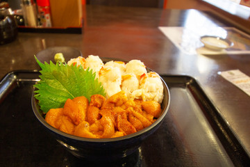 Japanese rice bowl with crab meat, uni (sea urchin) and shiso leaf