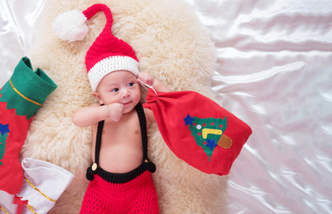 cute four-month baby  santa  with Christmas red dress