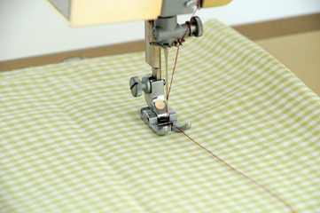 the sewing machine is prepared for the process of sewing clothes