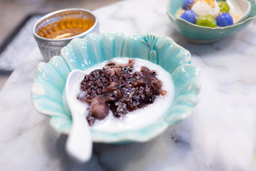 Soft sweet sticky rice with coconut cream. Thai traditional sweet dessert.