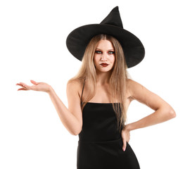 Fototapeta premium Beautiful woman dressed as witch for Halloween on white background
