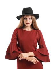 Fototapeta premium Beautiful woman dressed as witch for Halloween on white background
