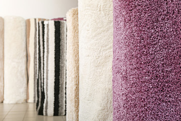 Many different carpets in shop