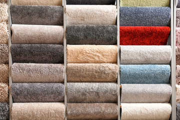 Different samples of carpets in shop