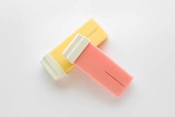 Liposoluble wax cartridges on white background