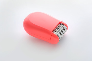 Modern epilator on white background