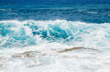 Natural background blue sea with waves, azure clear water beach