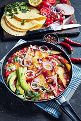 chilaquiles in a skillet on a table