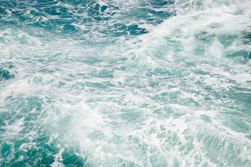Fototapeta na wymiar Natural background blue sea with waves, azure clear water beach