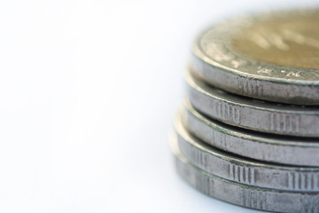 Close up Stack of coins on white background with copy space