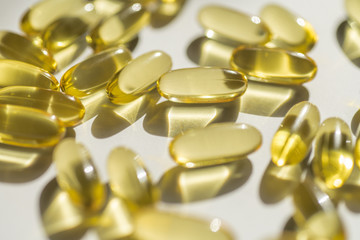 capsules of fish fat oil vitamin for heart, omega 3, macro