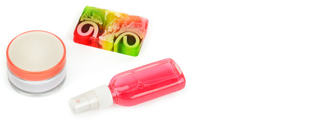Cosmetic cream , micellar water and handmade soap isolated on white . Free space for text. Wide photo.