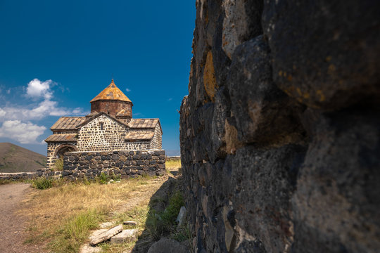 old Sevanavank monastery and Armenian landscape with monastery wall