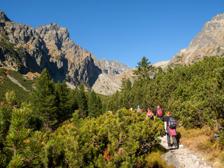 Vysoke Tatry, Slovakia - October 11, 2018: Hikers on trail at Valley of Five Spis Lakes. High Tatra Mountains, Slovakia.