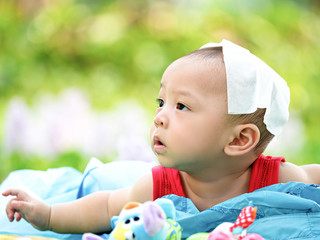 cute asian six-month baby in traditional dress