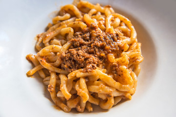 Tuscan pici pasta dish with meat sauce