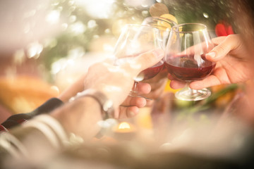 thanksgiving , christmas newyear Group of people having some drinks hand cheers together,...