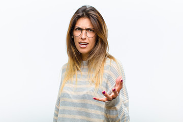 young pretty woman looking angry, annoyed and frustrated screaming wtf or what‚Äôs wrong with...