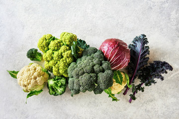 Cabbage of different varieties on a light background