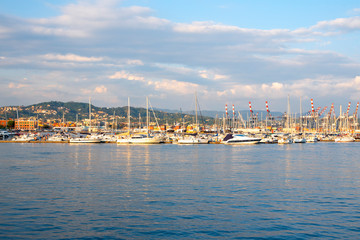 Fototapeta na wymiar Pier with boats, blue sea and sky