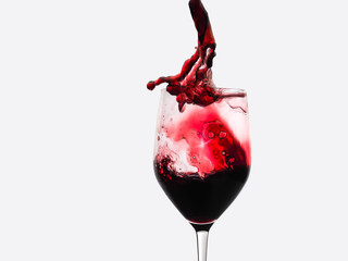 photo shoot of a glass of red wine separated