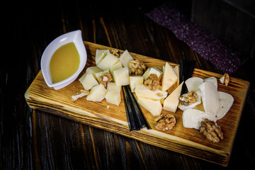 cheese board served with honey