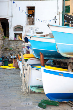 Old boats on a shore, building, background