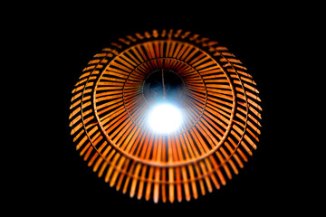 Orange bamboo lampshade with white lamp,
