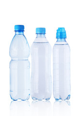 three full plastic bottles with mineral water