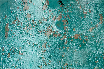 Peeling paint on an  rusty metal surface