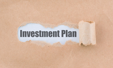 Letter Investment Plan Written Behind the Torn Paper