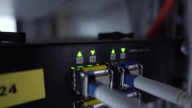 Two single mode optical connectors. Flashing up and down arrow. Video contains flickering.