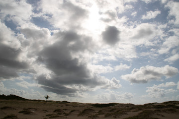 Fototapeta na wymiar clouds over dunes