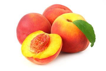 peach fruit with green leaves and slices isolated on white background