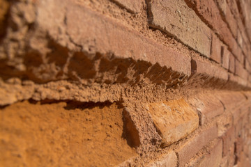 Background of closed up red brick wall texture. Angle view, oblique view. selective focus, texture, background