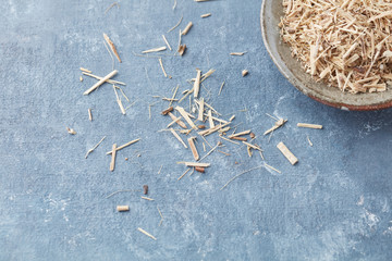 Siberian ginseng (Eleutherococcus senticosus) on rustic wooden background. Copy space. 